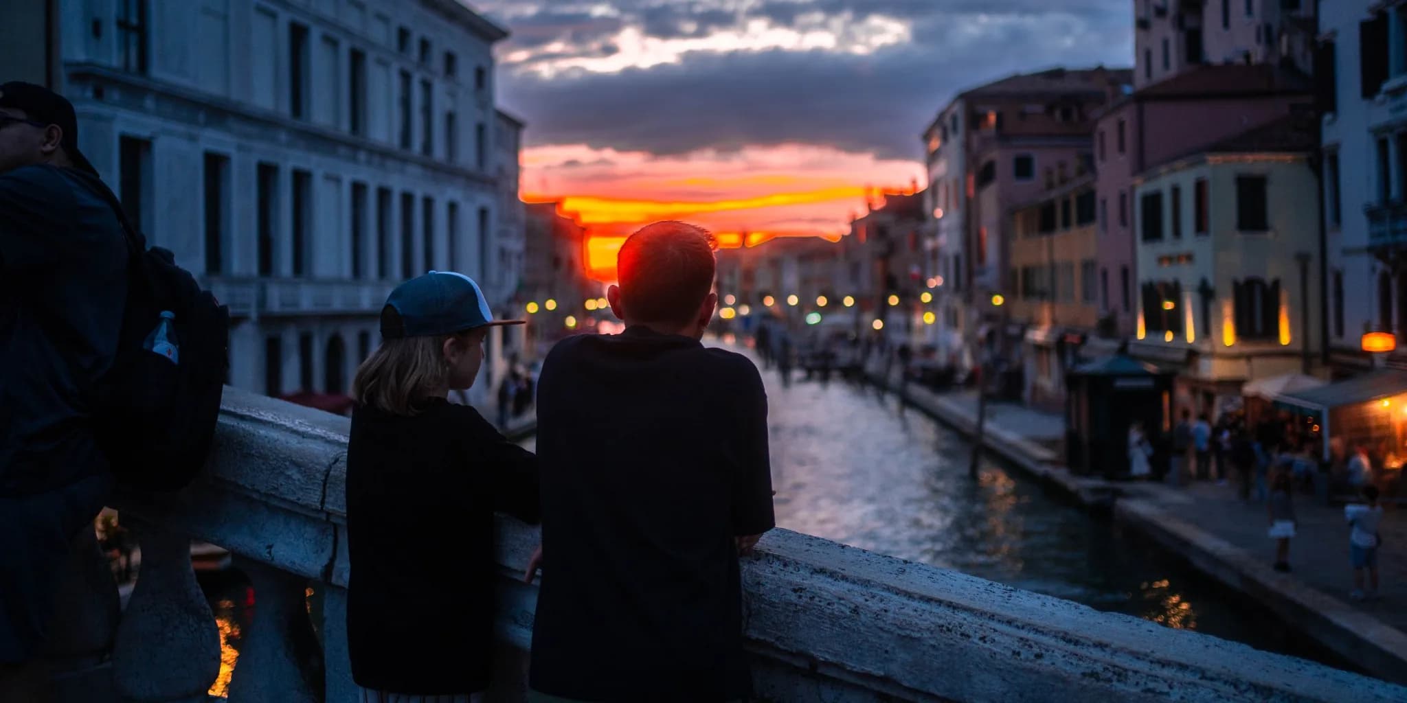 Sunset over a canal city skyline